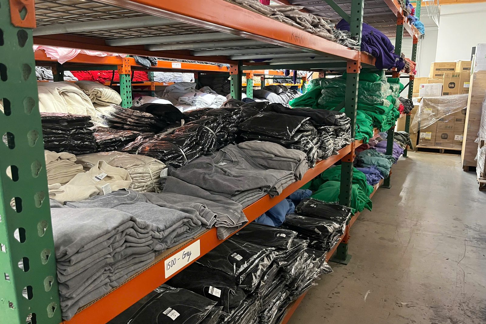 Bulk garment warehouse at Onospod Vietnam — inventory ready for eBay seller fulfillment